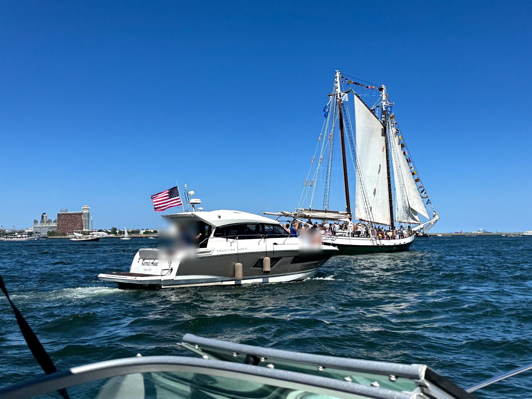 The Karrie Anne passing a tall ship on Boston Harbor