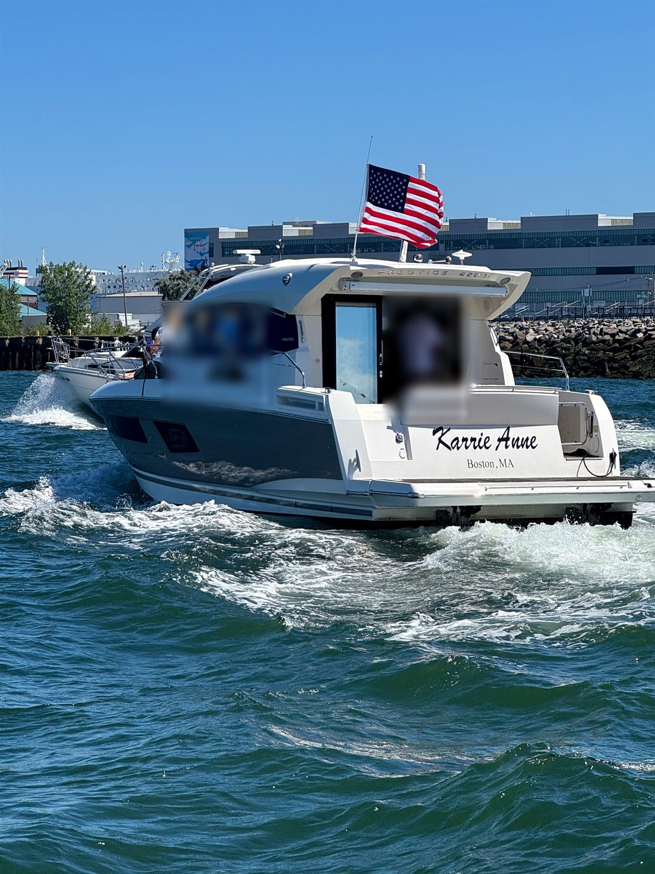 The Karrie Anne underway, stern view with nameplate