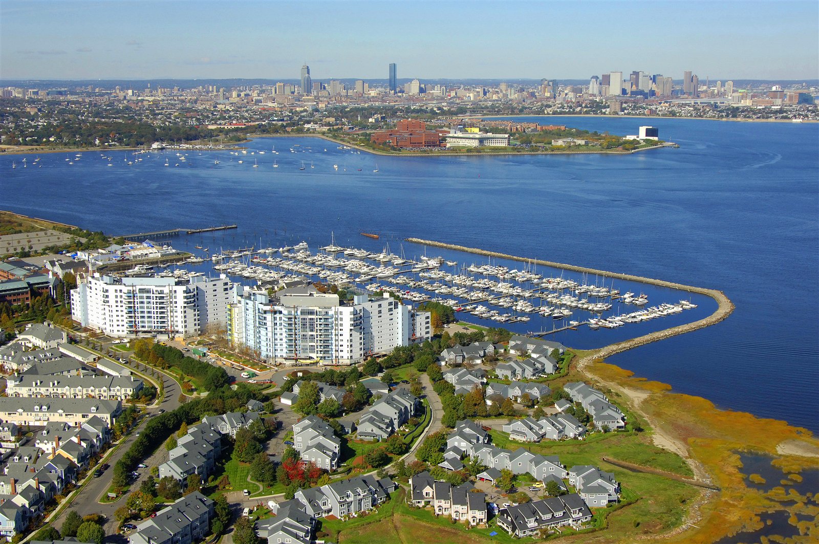 Aerial view of Marina Bay, Quincy, MA with the Boston skyline in the distance